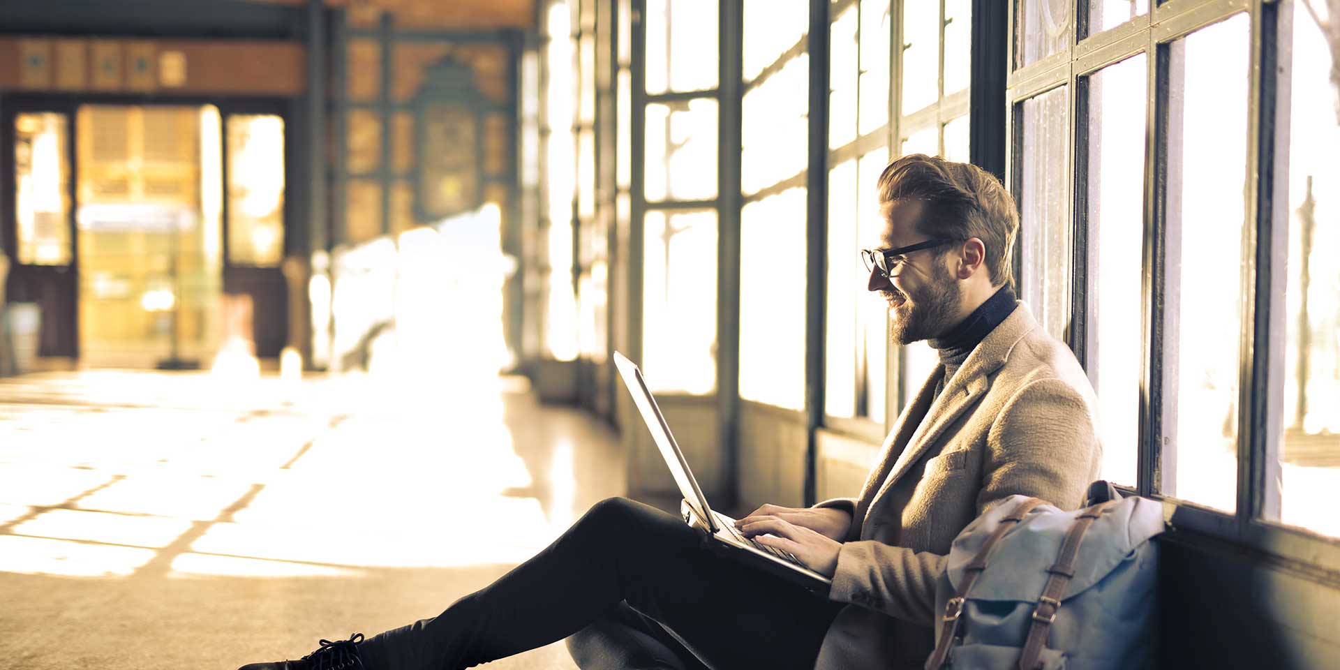 banner - man with laptop